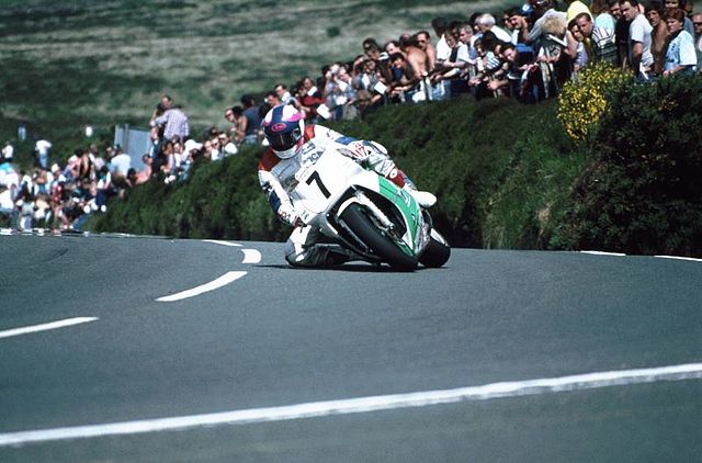Isle of Man TT Races 1992, crowd watching as racer comes round the bend.