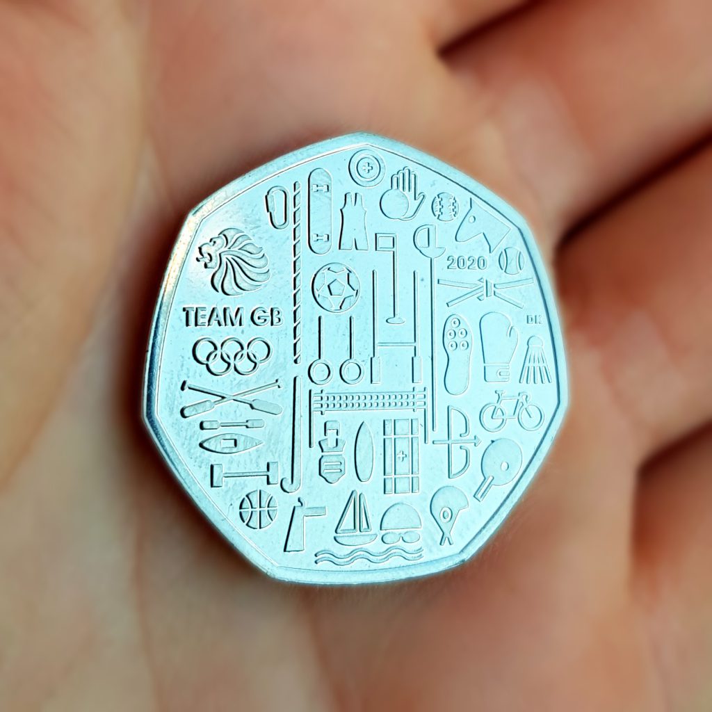 2021 Team GB 50p featuring 2020 date on reverse for the planned date of the Olympic Games.
Featuring different icons representing each Olympic sport