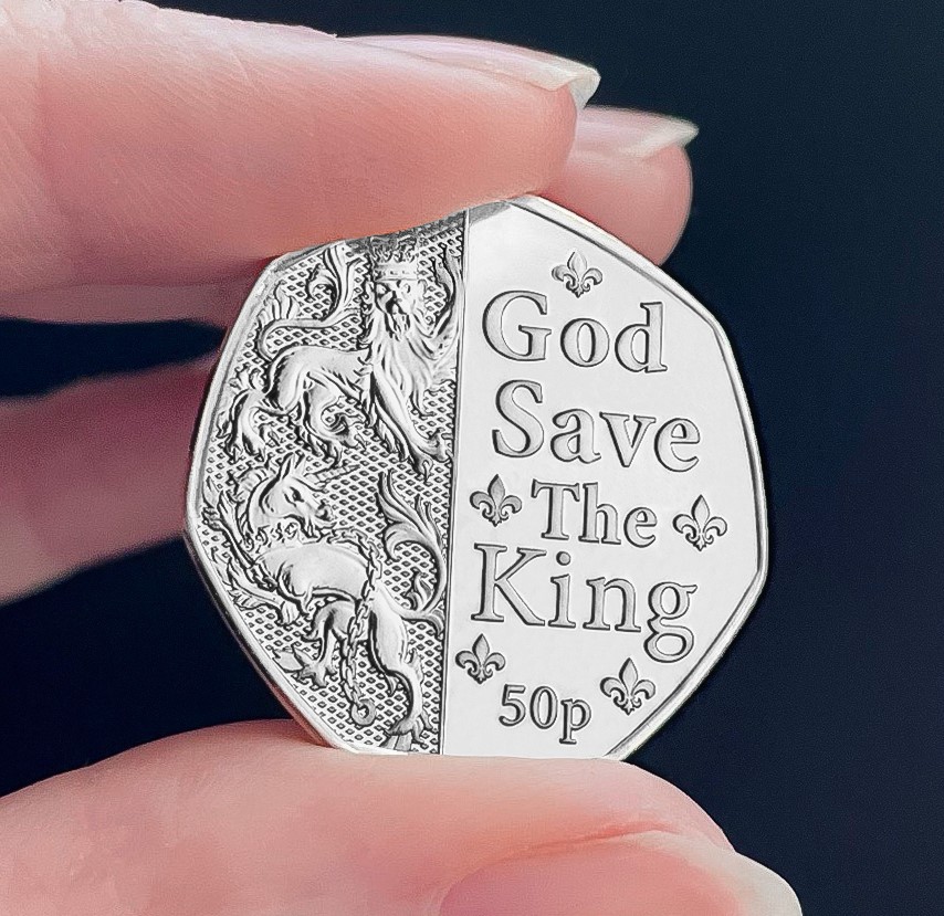 BU God Save the King 50p in hand