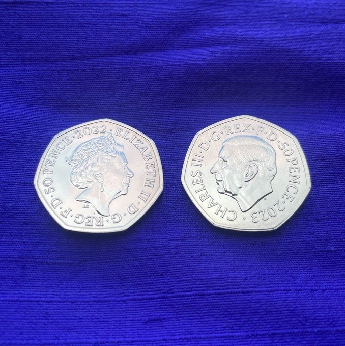 50p with Queen Elizabeth II effigy and 50p with King Charles III effigy